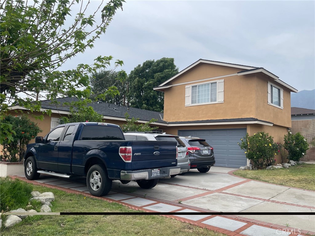 6250 Filkins Avenue Rancho Cucamonga, CA 91737 - Photo 5 of 48 a car parked in front of a house