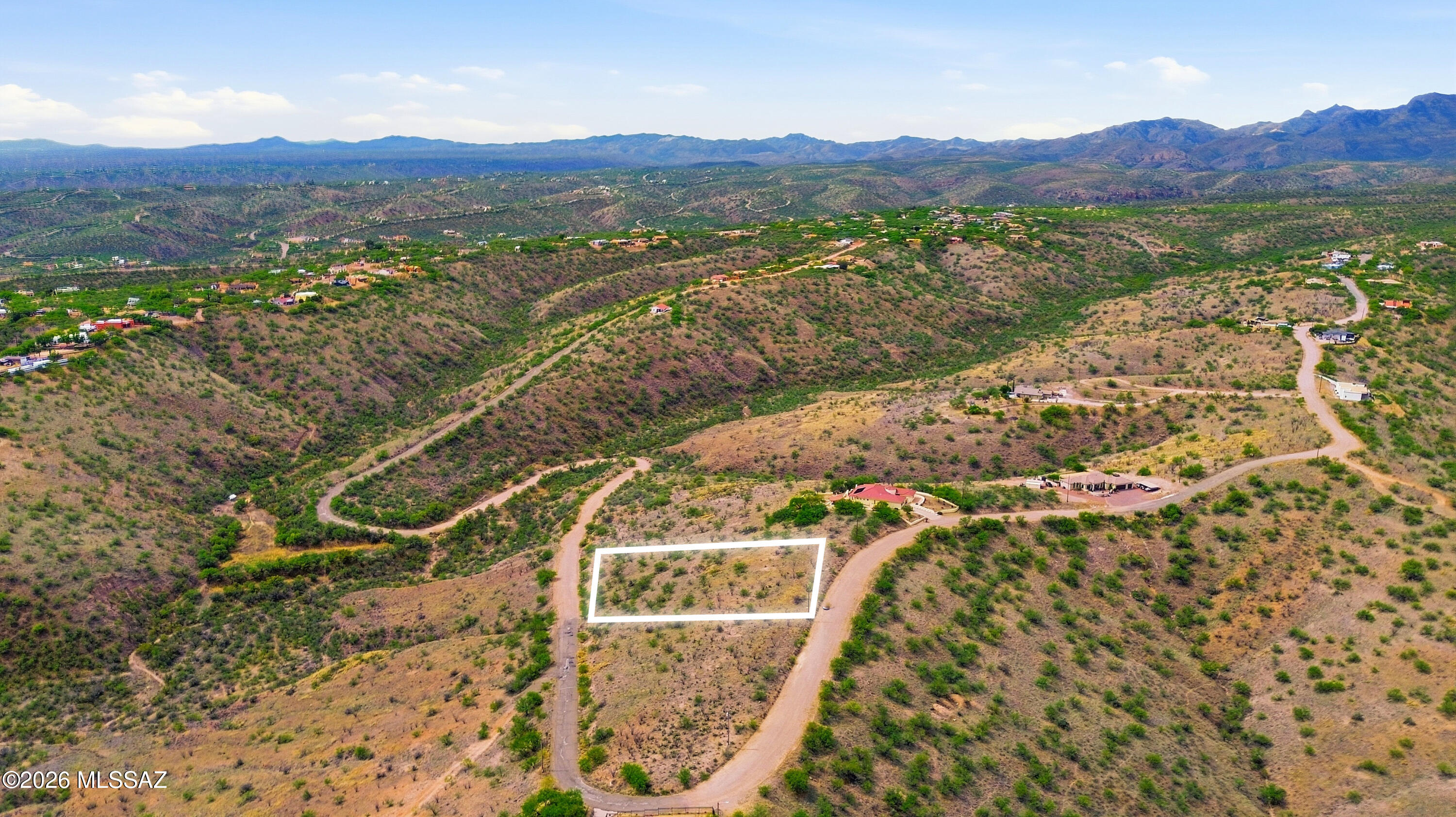 1525 Circulo Jacona, Unit 32 Rio Rico, AZ 85648 - Photo 10 of 13 a view of a lush green field with a mountain in the background
