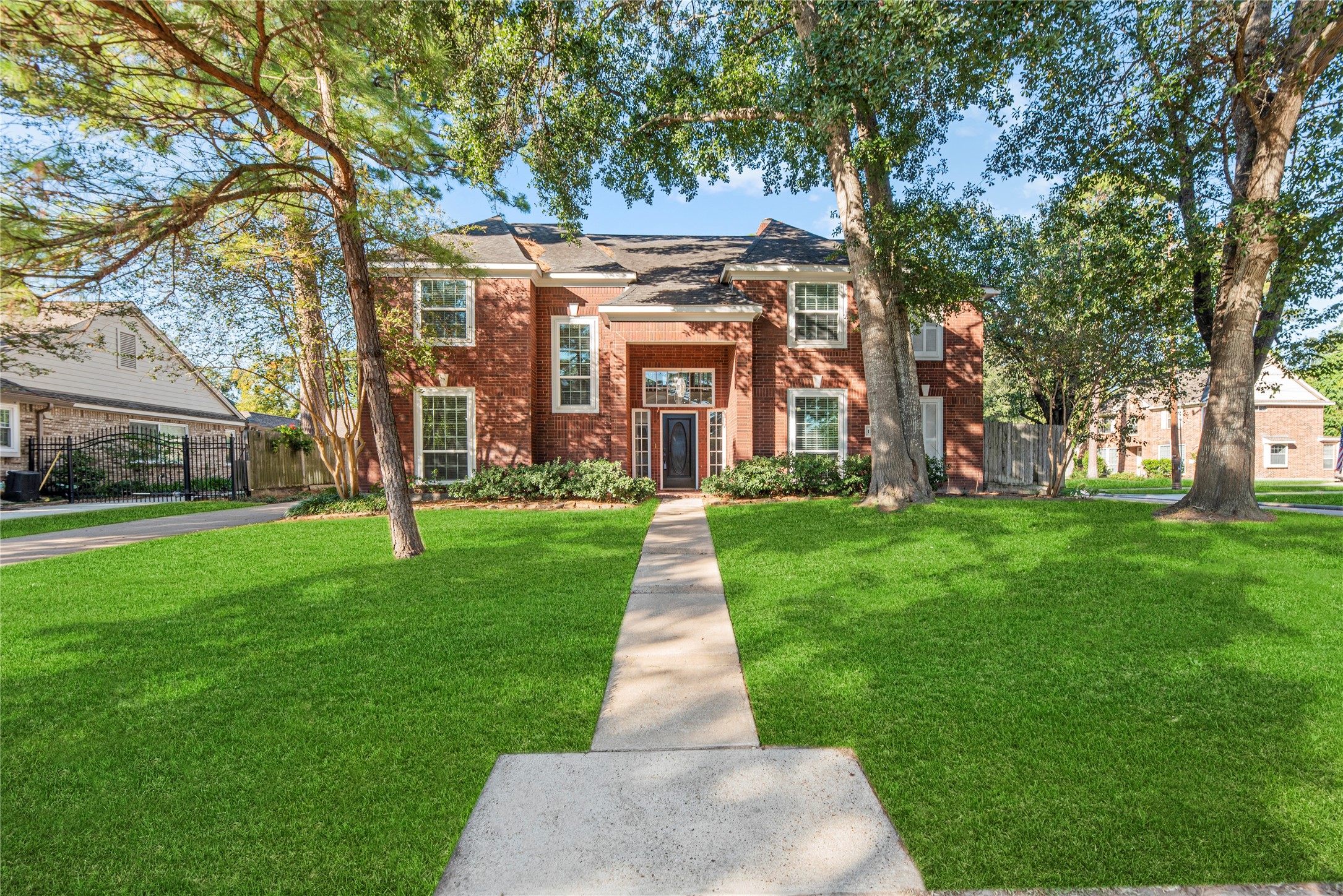 12502 Pavilion Court Tomball, TX 77377 - Photo 1 of 37 front view of a brick house with a yard