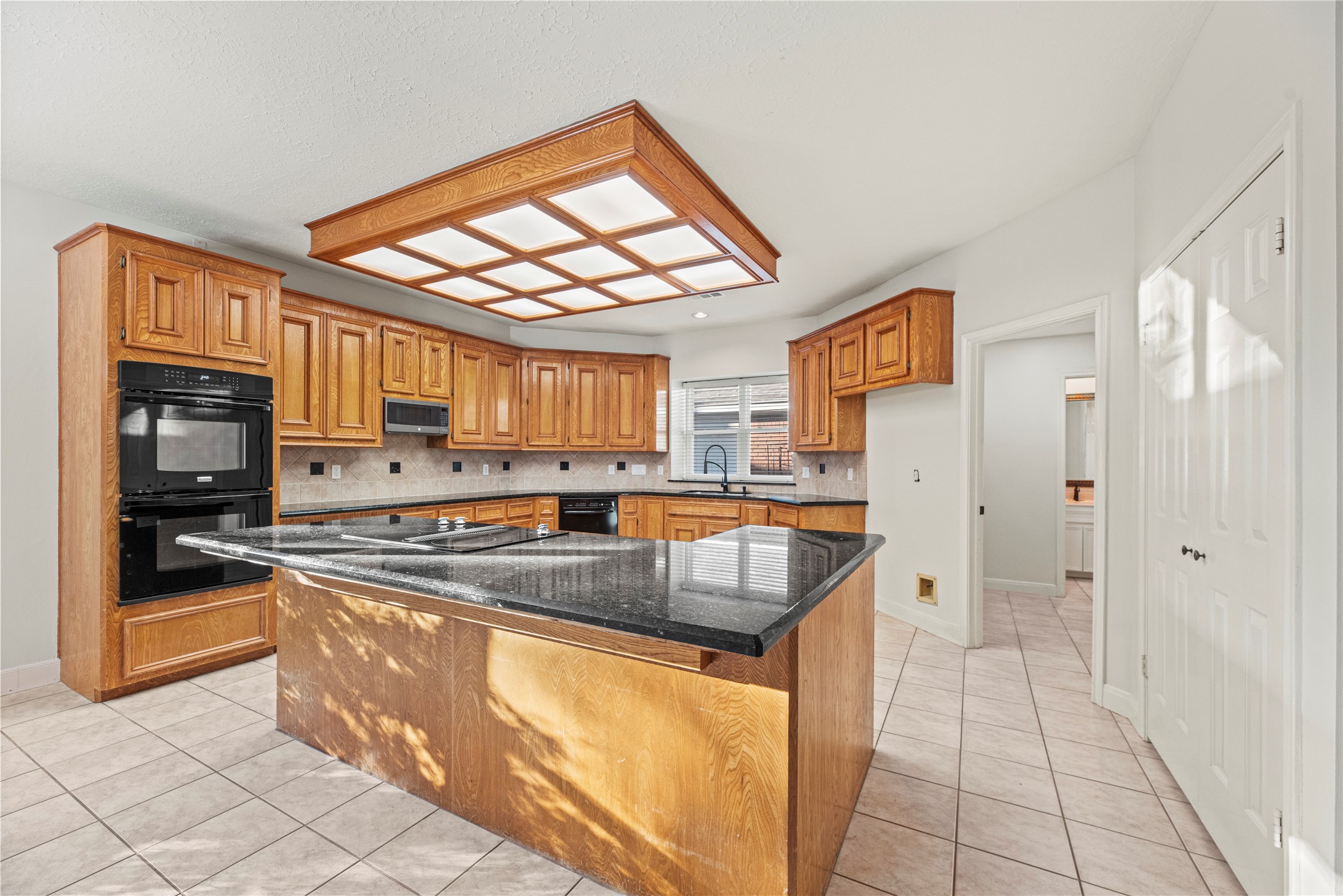 12502 Pavilion Court Tomball, TX 77377 - Photo 13 of 37 a kitchen with stainless steel appliances granite countertop a refrigerator and a sink
