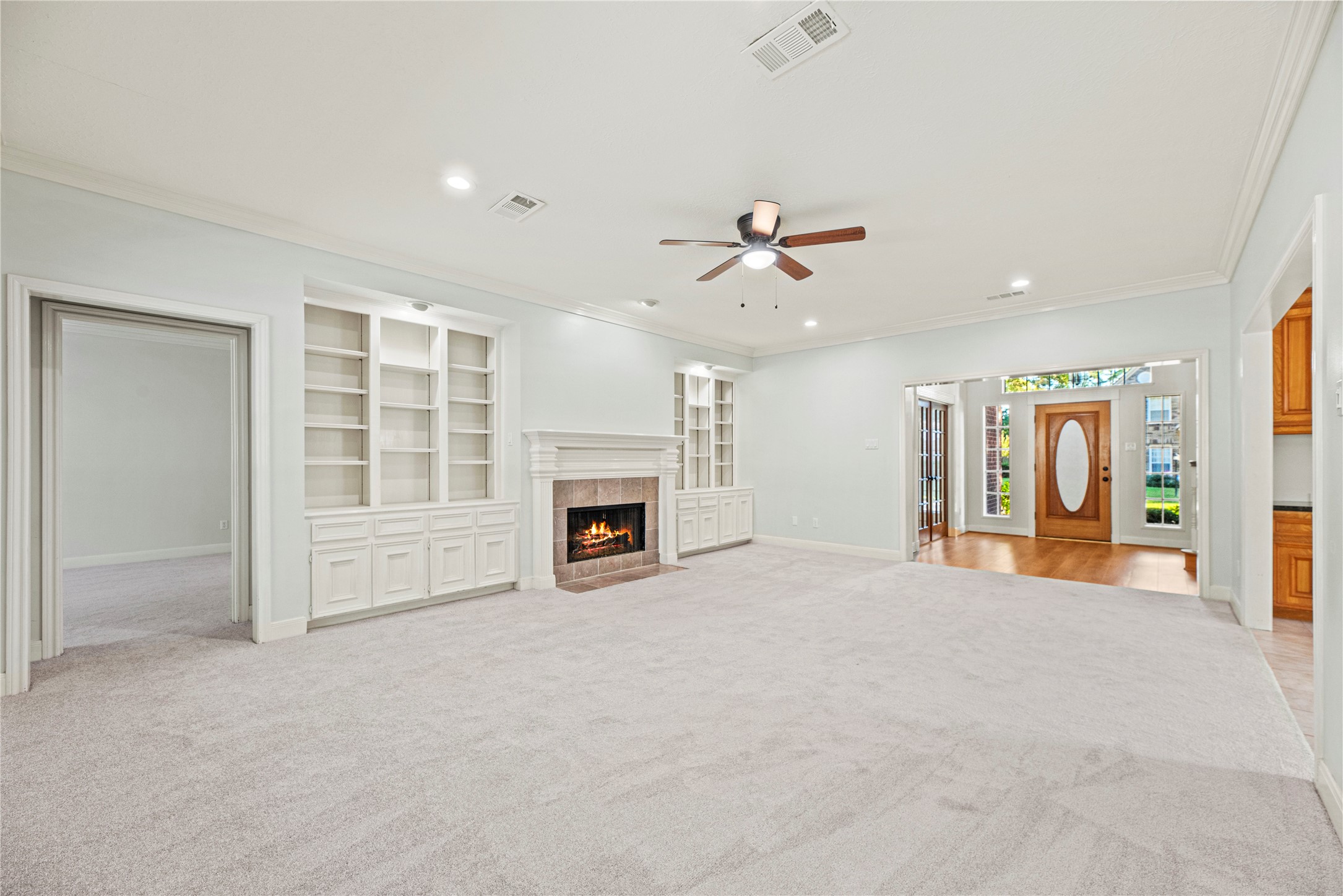 12502 Pavilion Court Tomball, TX 77377 - Photo 17 of 37 a view of an empty room with a fireplace and window