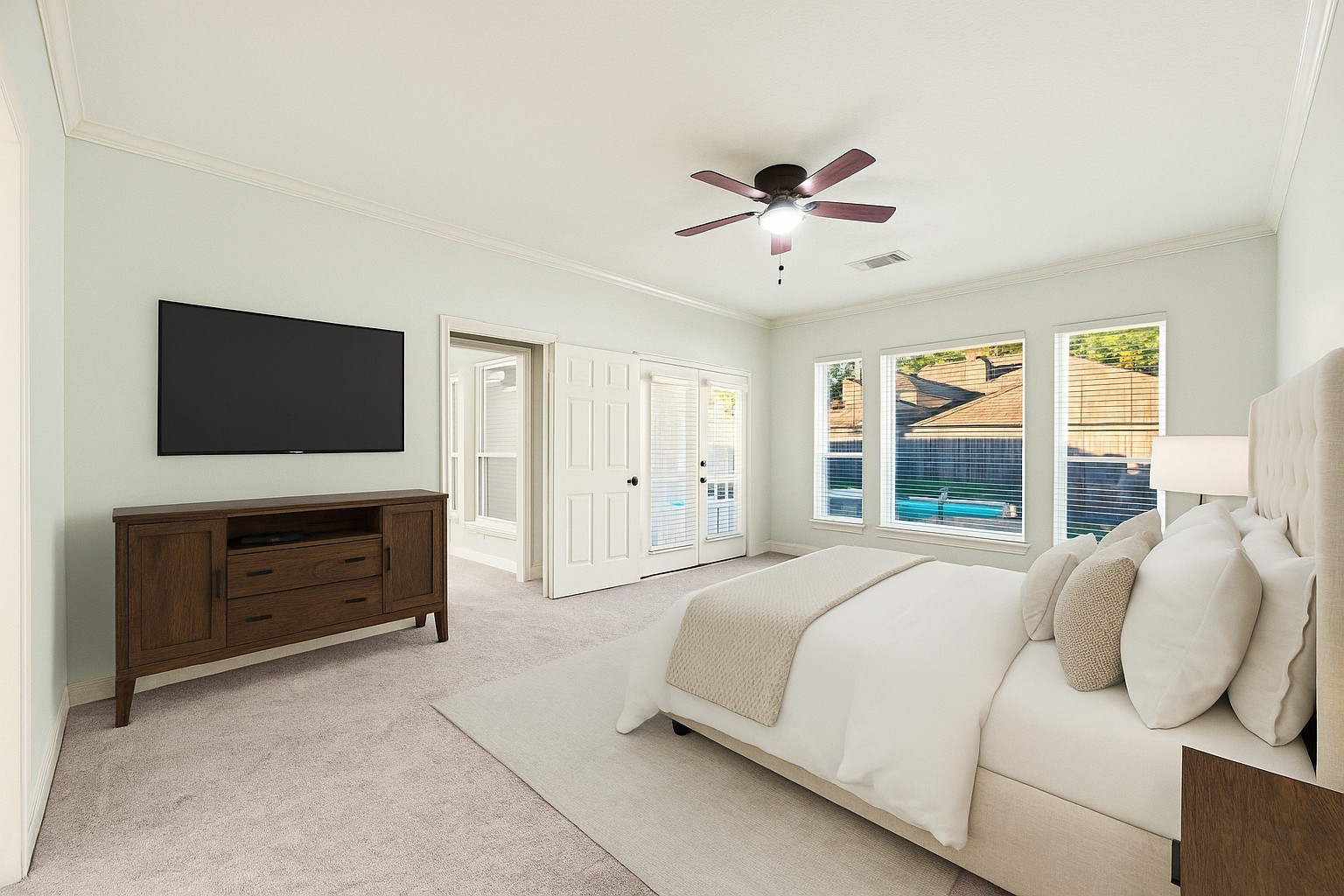 12502 Pavilion Court Tomball, TX 77377 - Photo 21 of 37 a bedroom with a bed and a flat screen tv