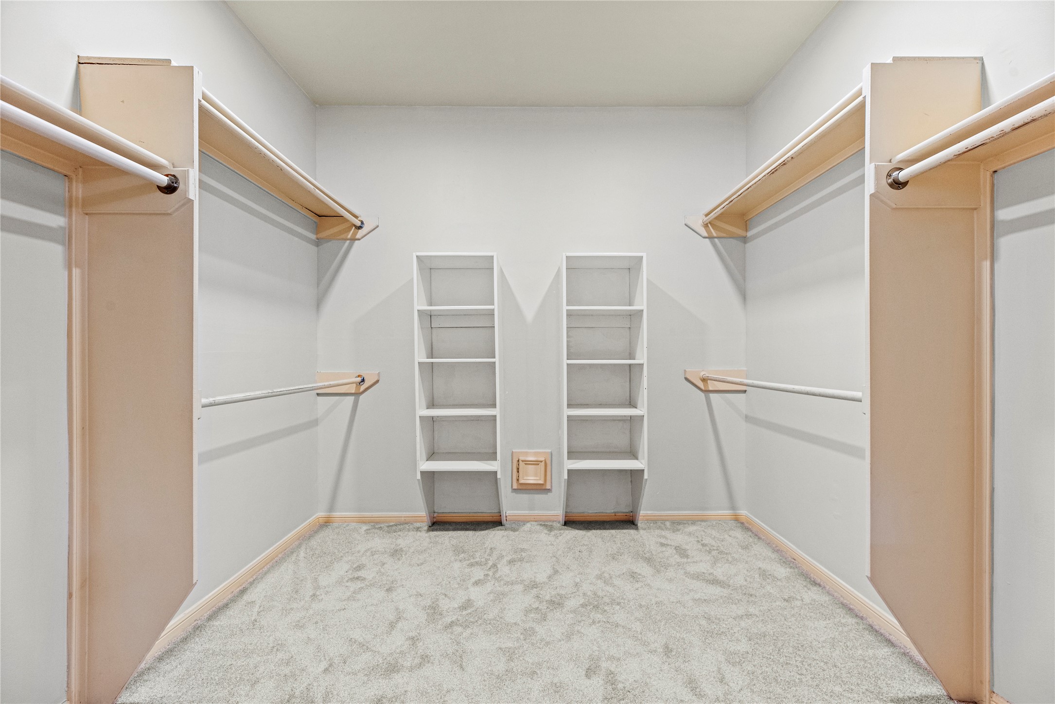12502 Pavilion Court Tomball, TX 77377 - Photo 24 of 37 a view of walk in closet with empty racks