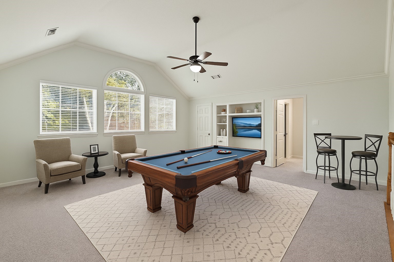 12502 Pavilion Court Tomball, TX 77377 - Photo 26 of 37 a living room with furniture a window and flat screen tv