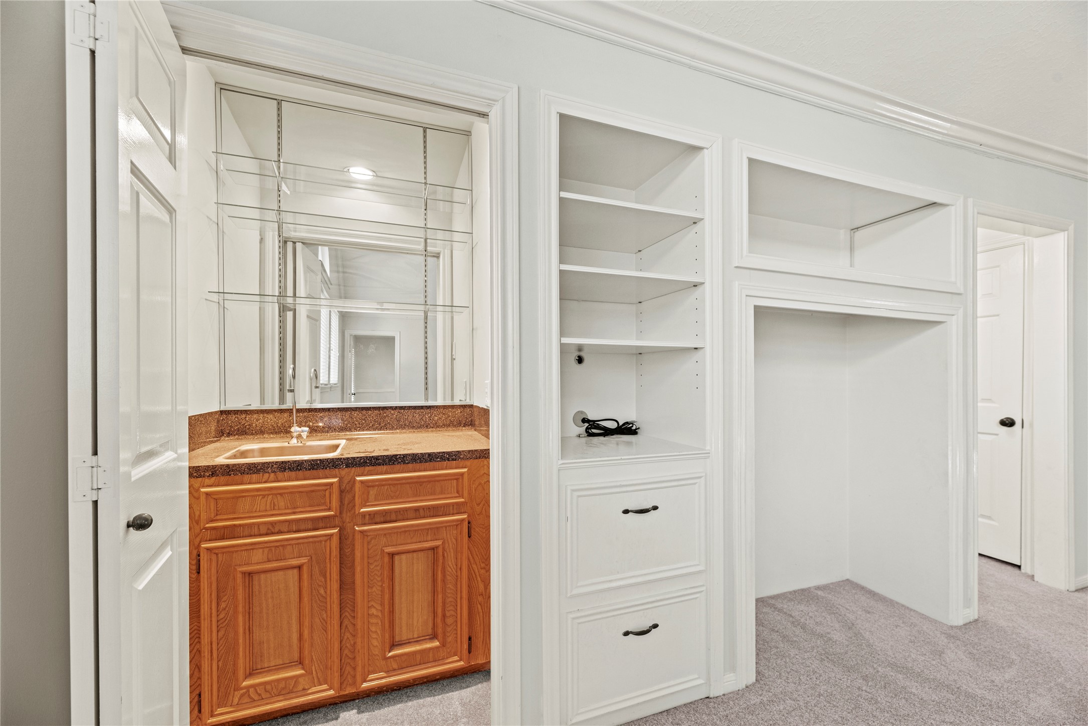 12502 Pavilion Court Tomball, TX 77377 - Photo 27 of 37 a room with cabinets and a closet