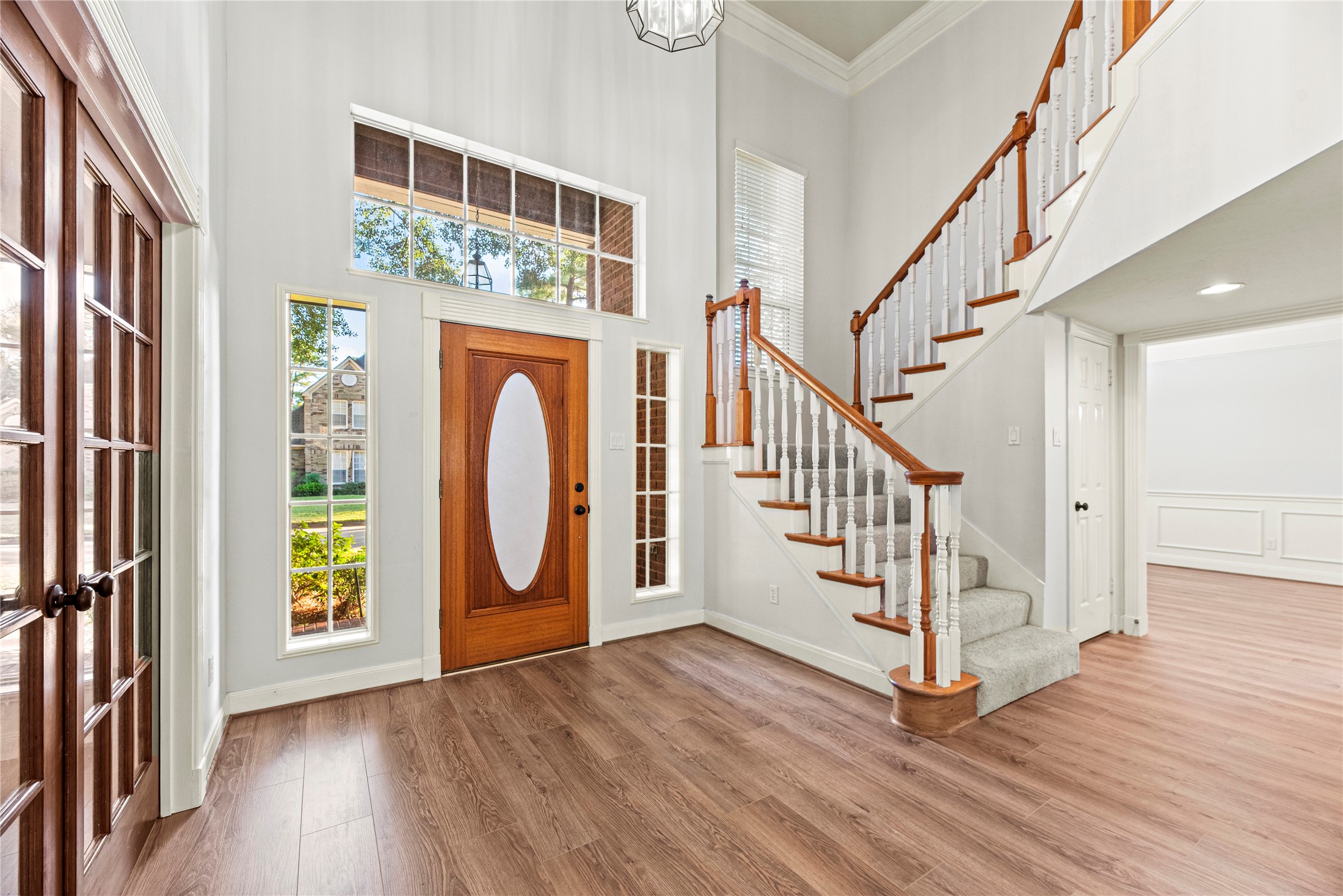 12502 Pavilion Court Tomball, TX 77377 - Photo 5 of 37 a view of an entryway with wooden floor and door