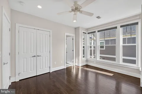 a view of an empty room and wooden floor
