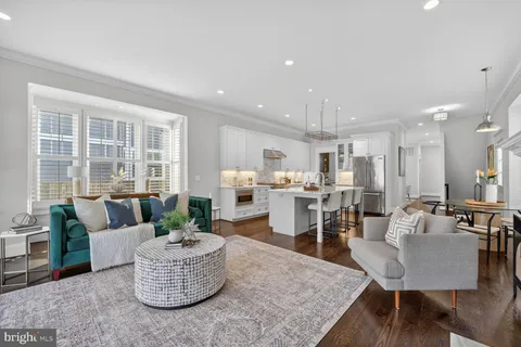 a large kitchen with a table and chairs