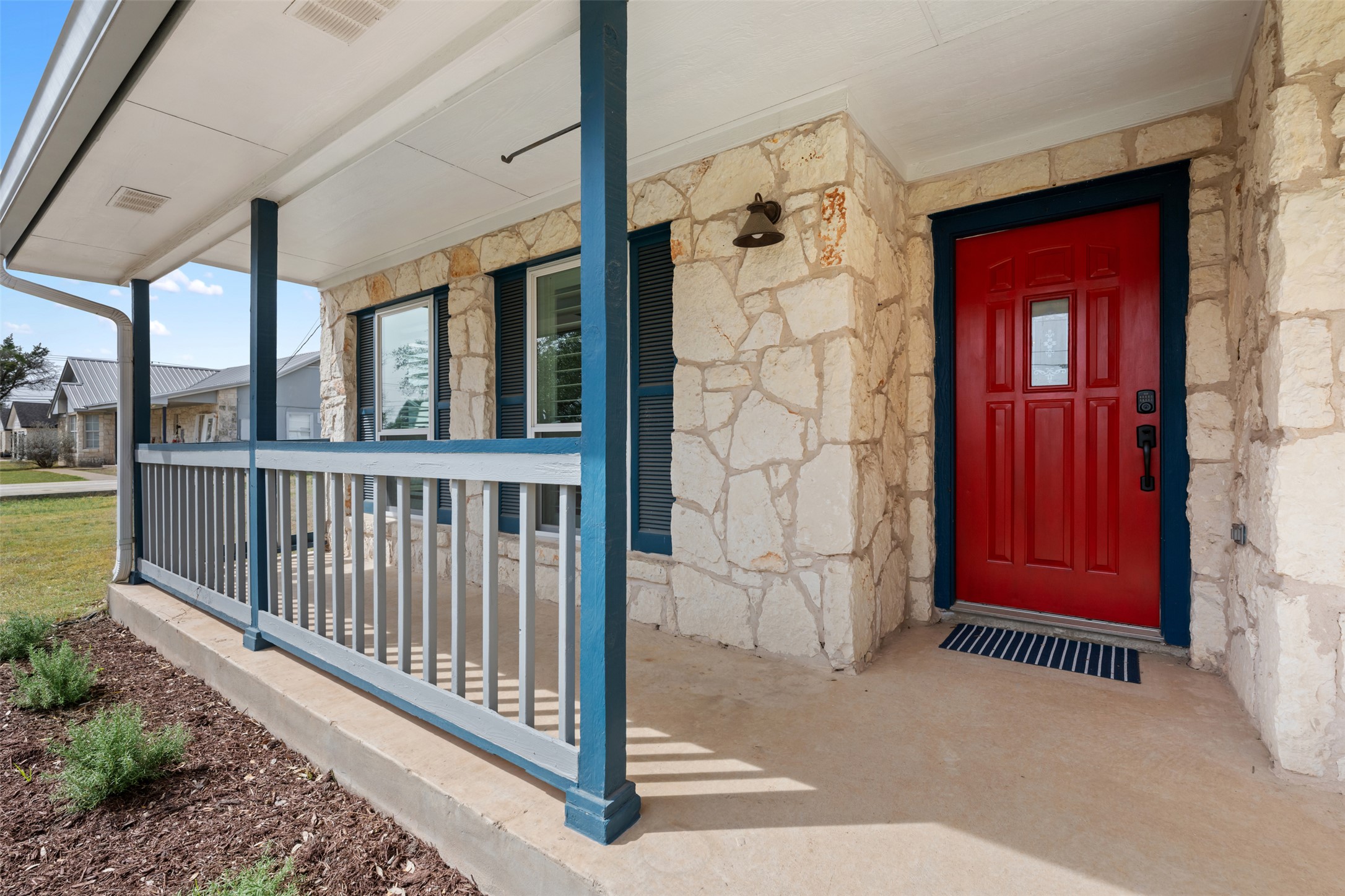 104 Sunset Road Georgetown, TX 78633 - Photo 4 of 40 View of exterior entry featuring stone siding and a porch