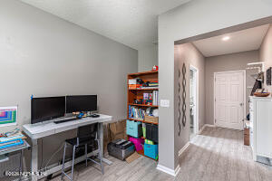 404 Hepburn Road Orange Park, FL 32065 - Photo 16 of 31 a view of a workspace with furniture and wooden floor