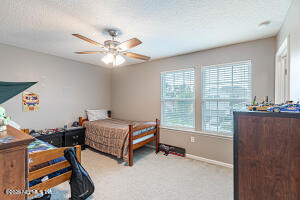 404 Hepburn Road Orange Park, FL 32065 - Photo 20 of 31 a bedroom with two bunk beds and a window