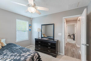 404 Hepburn Road Orange Park, FL 32065 - Photo 23 of 31 a bedroom with a bed and a dresser