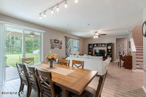 404 Hepburn Road Orange Park, FL 32065 - Photo 6 of 31 a view of a dining room with furniture window and wooden floor