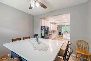 a dining room with furniture and window