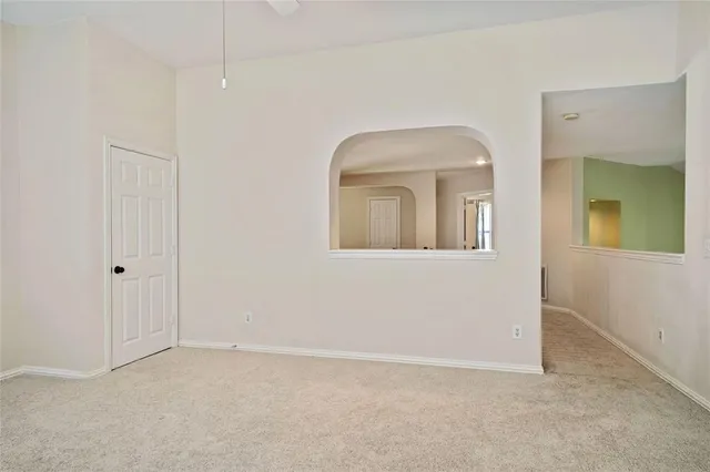 an empty room that has a mirror