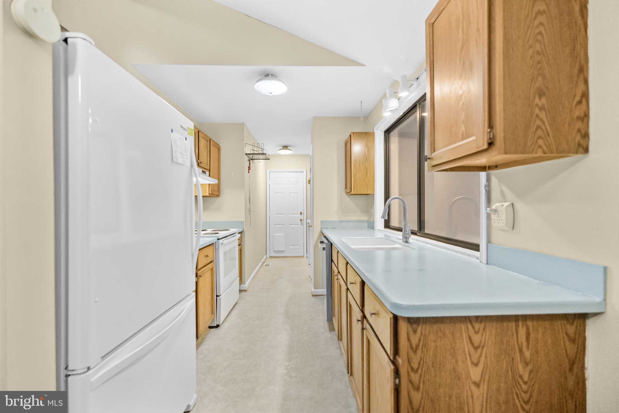 124 Saylers Creek Road Locust Grove, VA 22508 - Photo 13 of 55 a kitchen with cabinets and stainless steel appliances