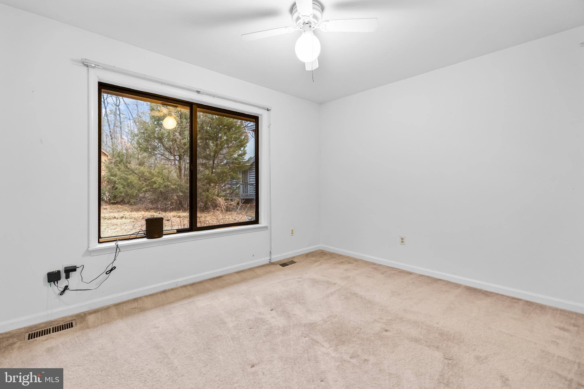 124 Saylers Creek Road Locust Grove, VA 22508 - Photo 17 of 55 a view of an empty room with a window