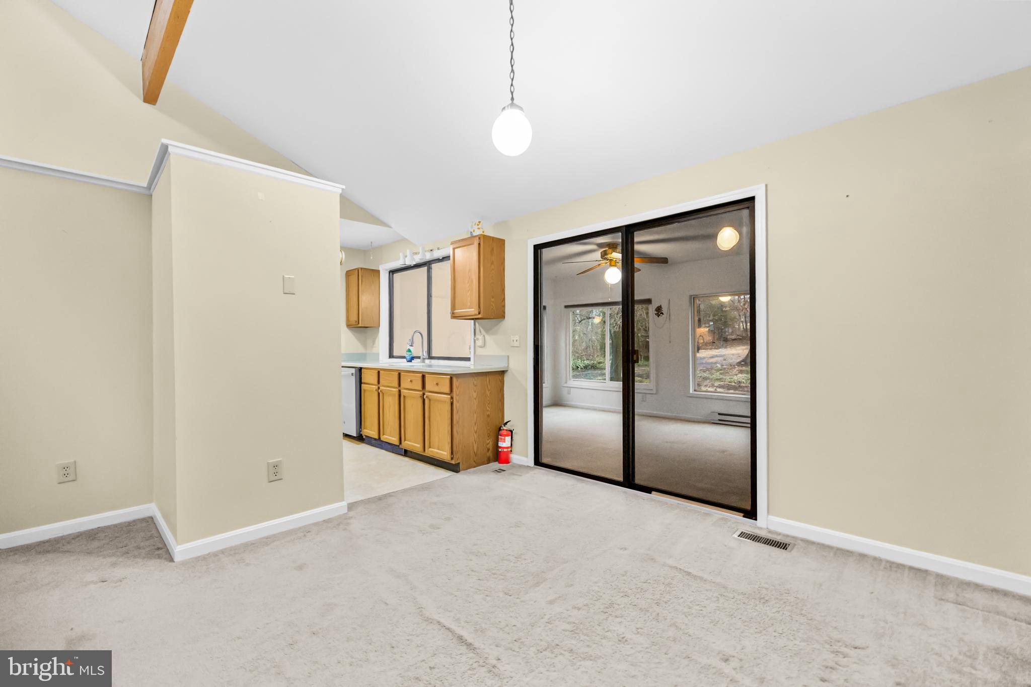 124 Saylers Creek Road Locust Grove, VA 22508 - Photo 7 of 55 a view of a refrigerator in kitchen and white cabinets