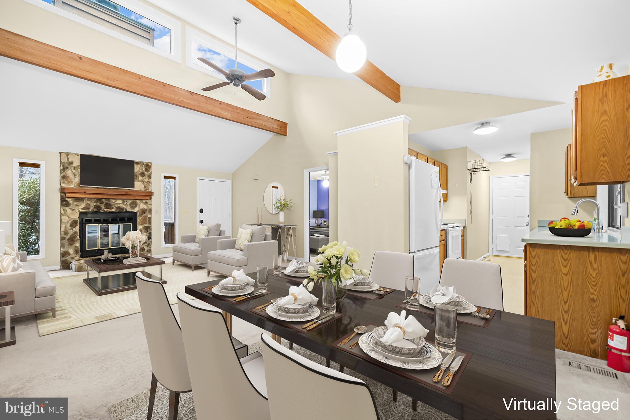 124 Saylers Creek Road Locust Grove, VA 22508 - Photo 8 of 55 a view of a dining room and livingroom with furniture a rug a kitchen and a chandelier