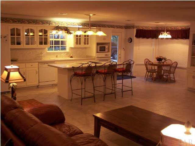 5816 Rutherford Road Pace, FL 32571 - Photo 11 of 24 View of kitchen & great room from hallway. Additional bedrooms to the right.