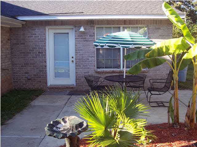 5816 Rutherford Road Pace, FL 32571 - Photo 21 of 24 View of patio area & door to great room from pool.