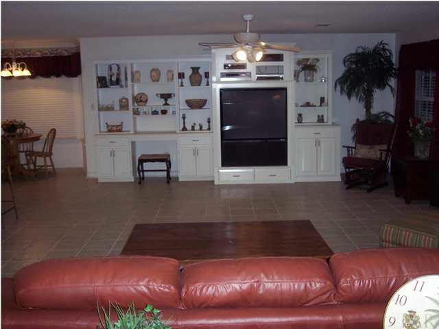 5816 Rutherford Road Pace, FL 32571 - Photo 4 of 24 View of built-in book shelves in great room. Kitchen & laundry room to your left & french door to your right leads to pool.