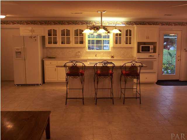 5816 Rutherford Road Pace, FL 32571 - Photo 7 of 24 View of eat-at bar from great room. Breakfast nook to your right.