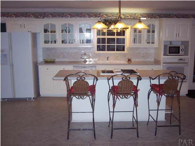 5816 Rutherford Road Pace, FL 32571 - Photo 8 of 24 Close up of eat-at bar. Laundry room to your left.