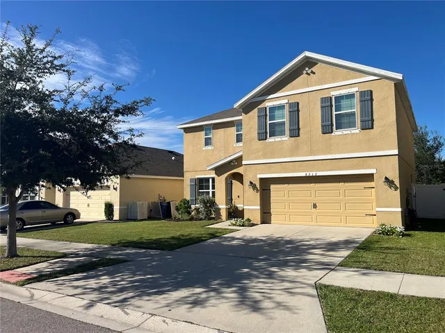 a front view of a house with a yard