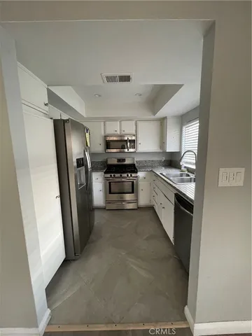 an empty room with a empty space and a ceiling fan