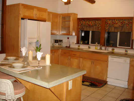 6410 Puupilo Road Kapaa, HI 96746 - Photo 3 of 21 a kitchen with a sink a counter top space and cabinets