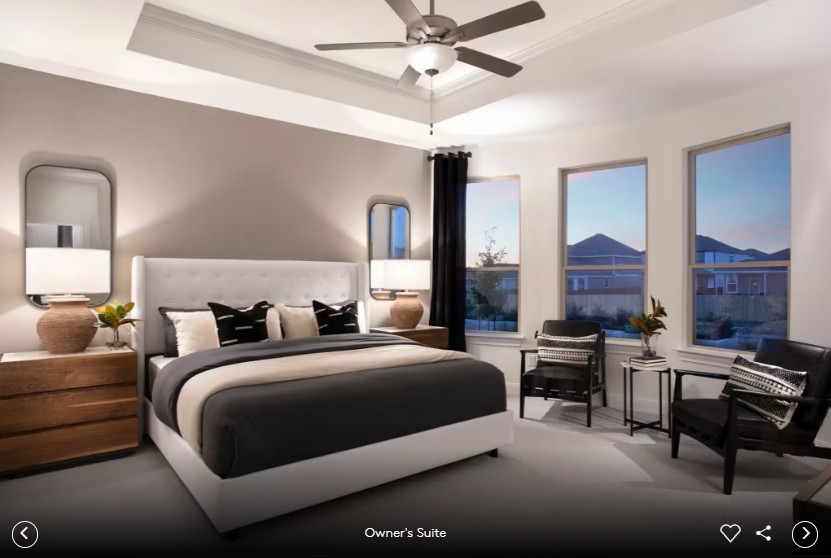 167 Poinsettia Road Buda, TX 78610 - Photo 6 of 9 a bedroom with a bed and a chandelier