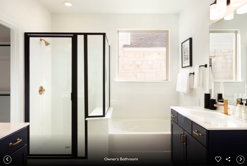 167 Poinsettia Road Buda, TX 78610 - Photo 7 of 9 a bathroom with a shower sink and mirror