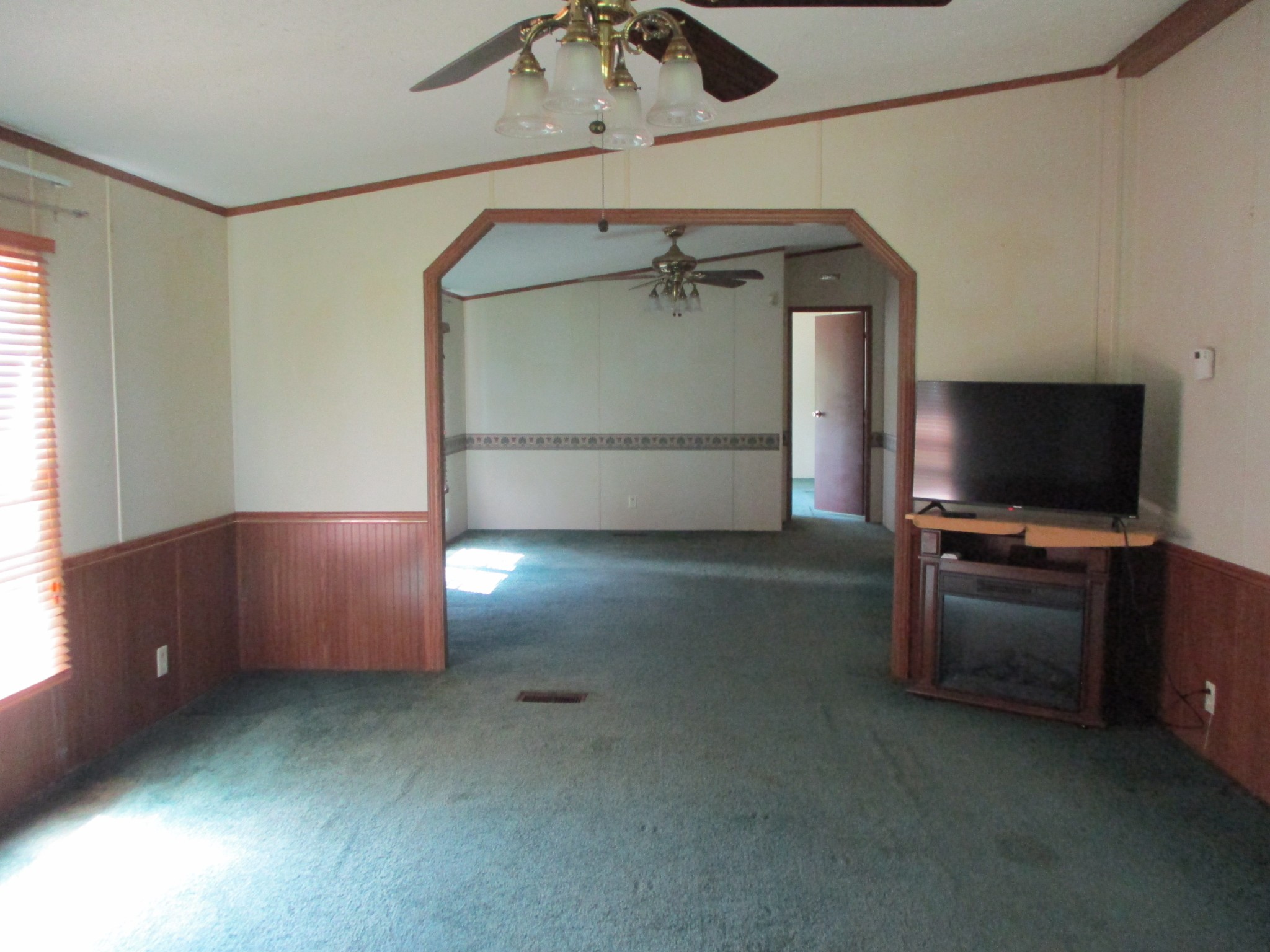 2080 North Commerce Road Lebanon, TN 37090 - Photo 12 of 40 a living room with furniture and a flat screen tv