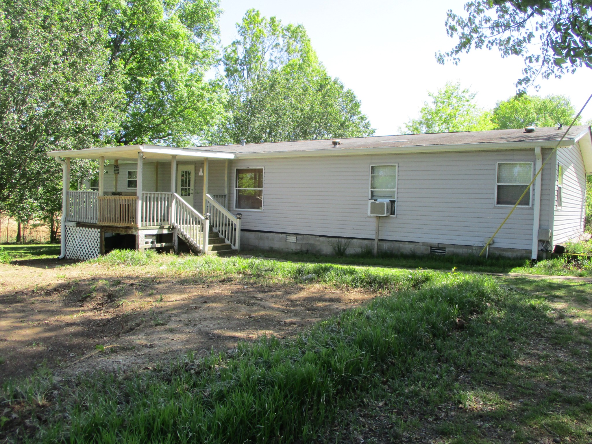 2080 North Commerce Road Lebanon, TN 37090 - Photo 2 of 40 a backyard of a house with barbeque oven table and chairs