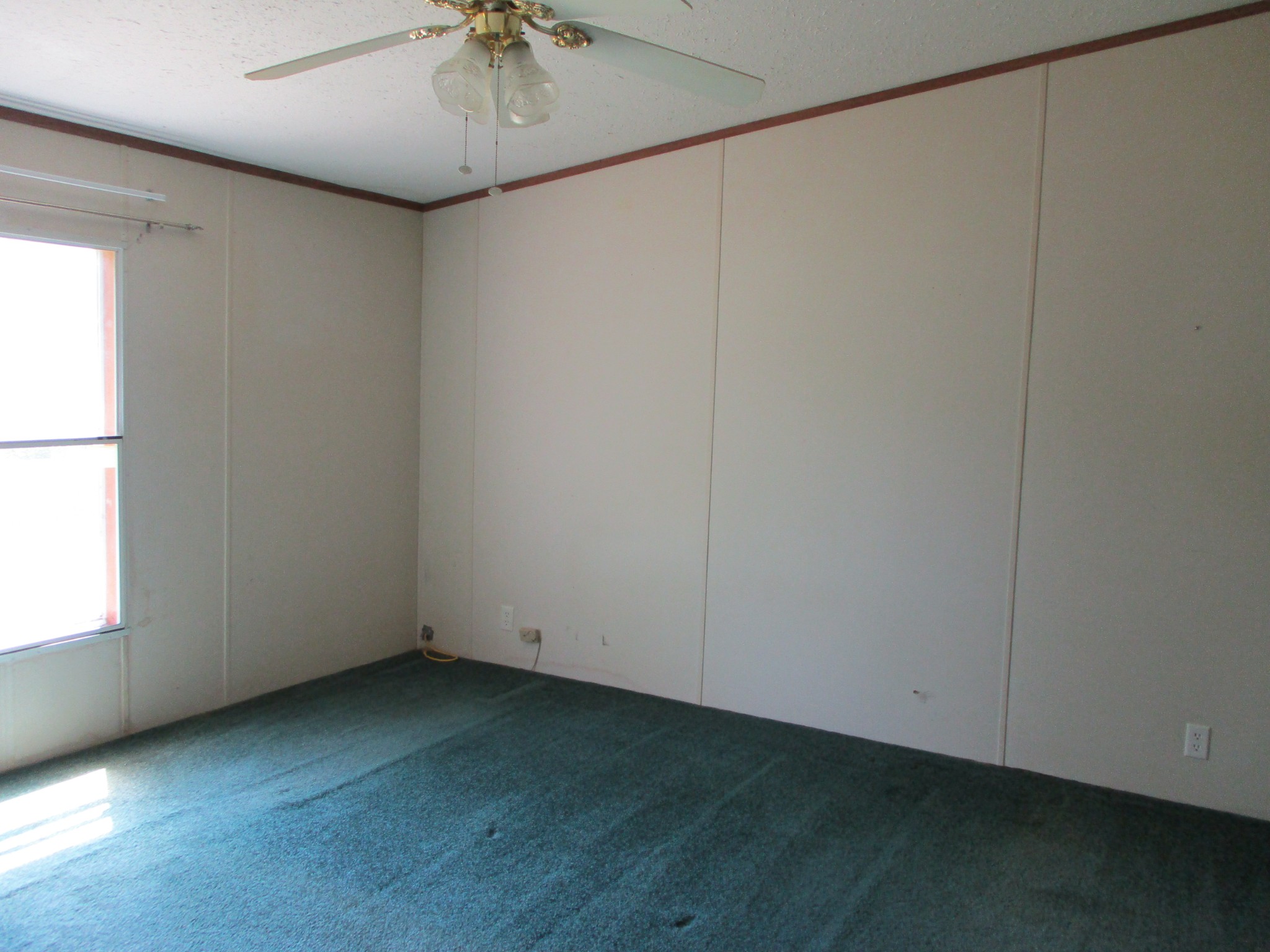 2080 North Commerce Road Lebanon, TN 37090 - Photo 21 of 40 an empty room with a window and a ceiling fan