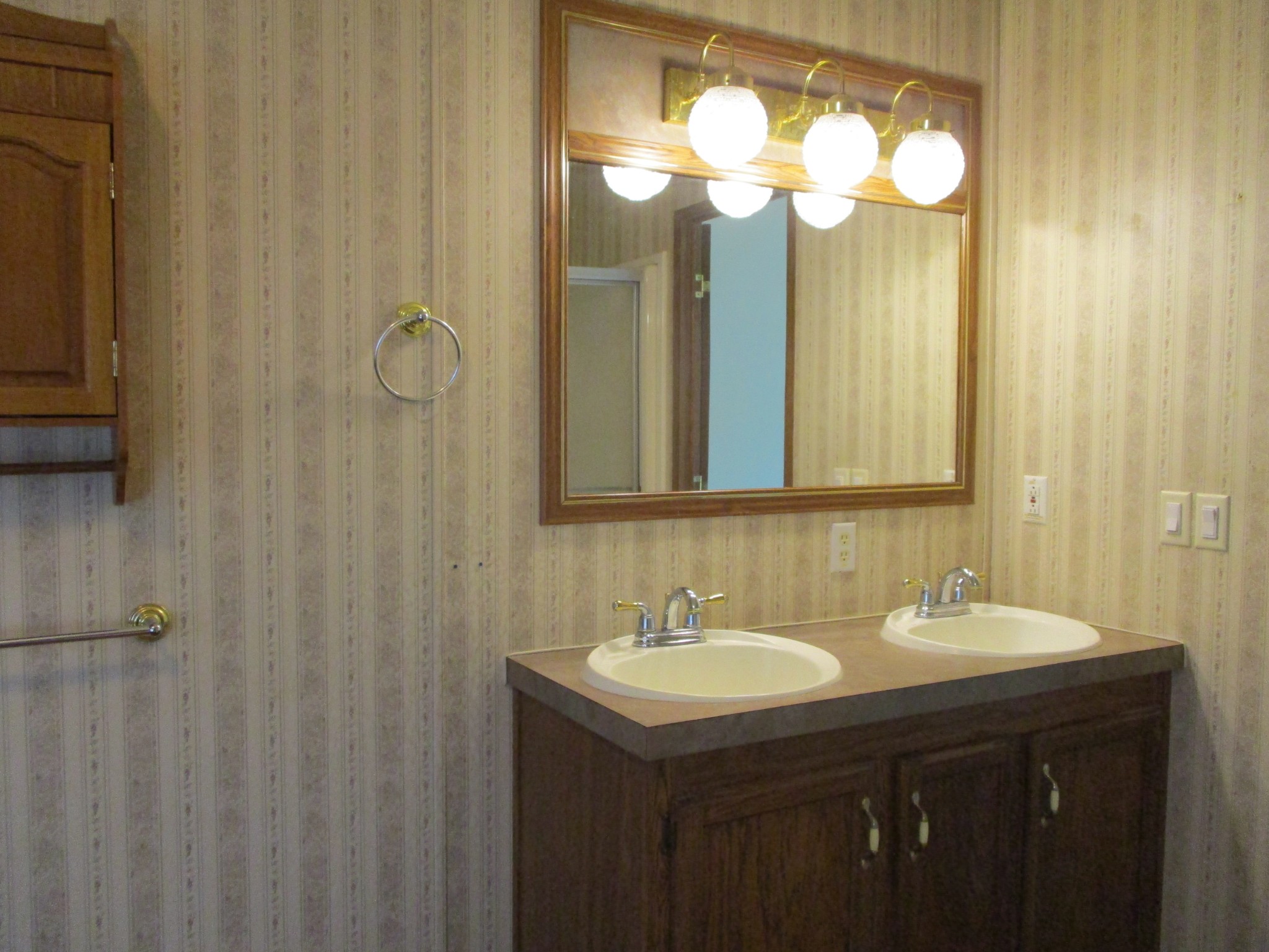 2080 North Commerce Road Lebanon, TN 37090 - Photo 23 of 40 a bathroom with a double vanity sink and a mirror