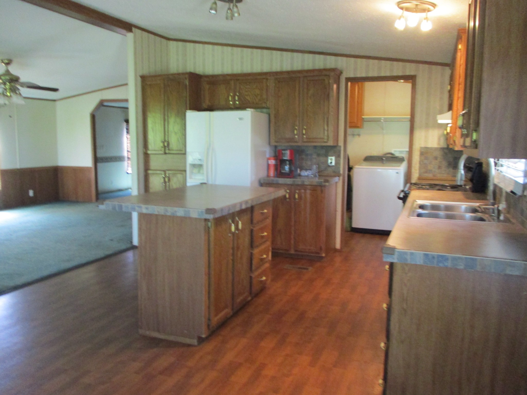 2080 North Commerce Road Lebanon, TN 37090 - Photo 8 of 40 a kitchen with sink cabinets and wooden floor
