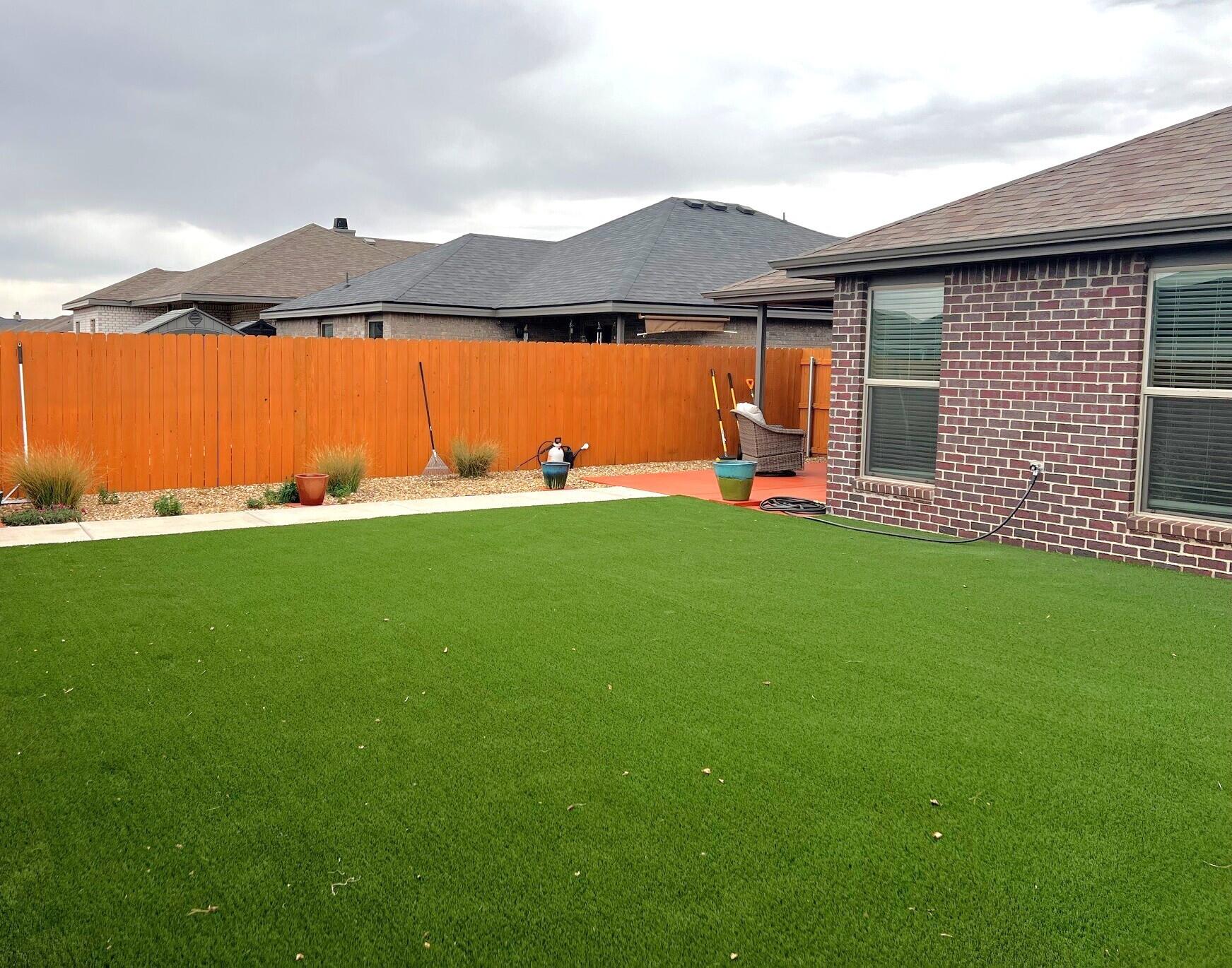 2006 135th Street Lubbock, TX 79423 - Photo 3 of 24 a front view of a house with a yard and garage