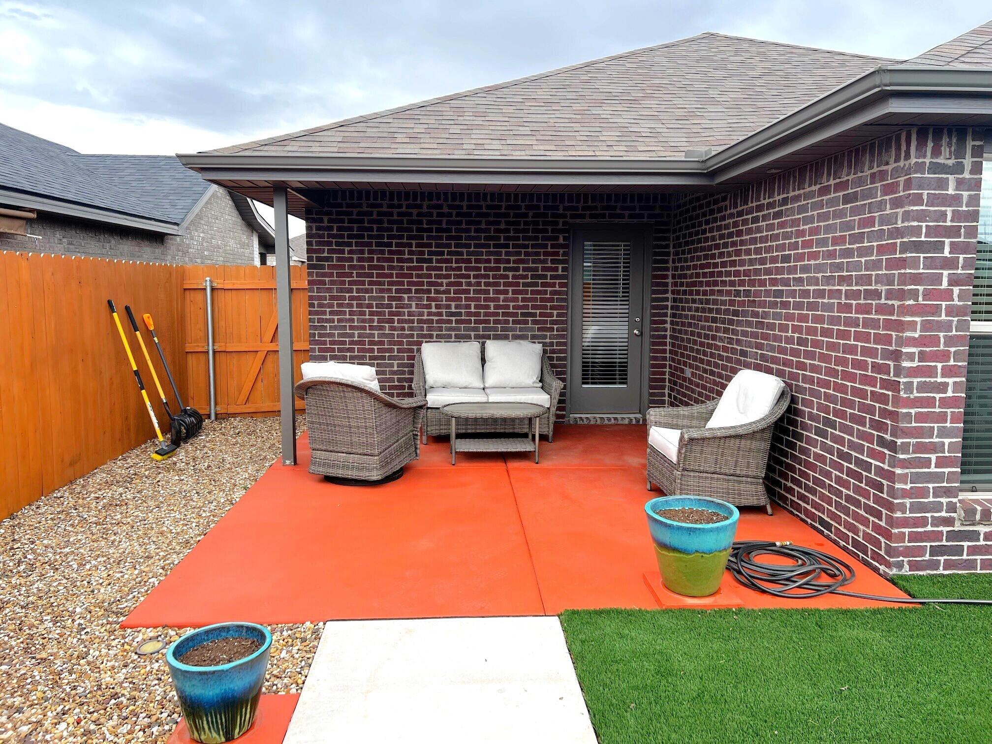 2006 135th Street Lubbock, TX 79423 - Photo 4 of 24 a backyard of a house with yard and outdoor seating