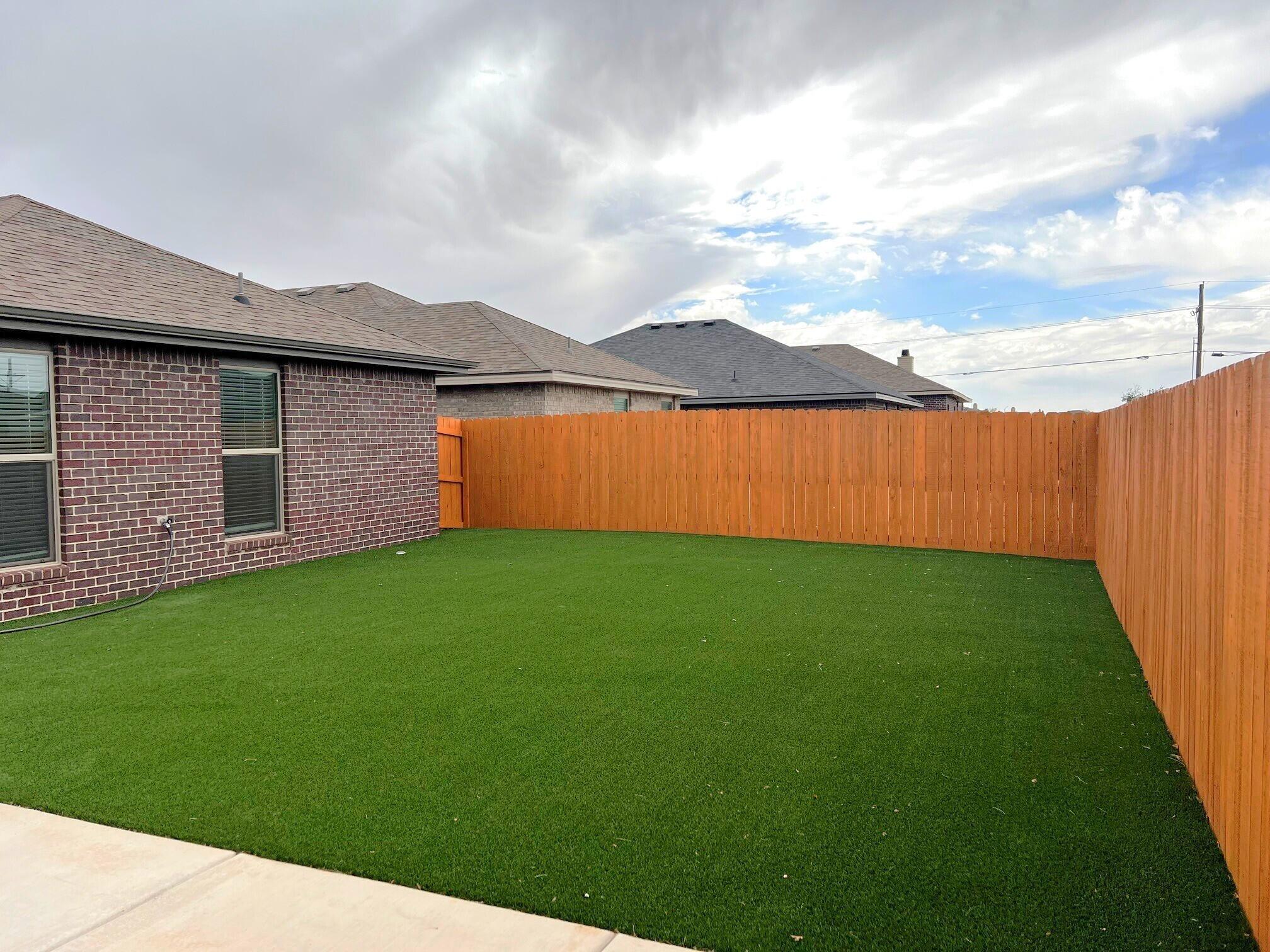 2006 135th Street Lubbock, TX 79423 - Photo 5 of 24 a backyard of a house with lots of green space