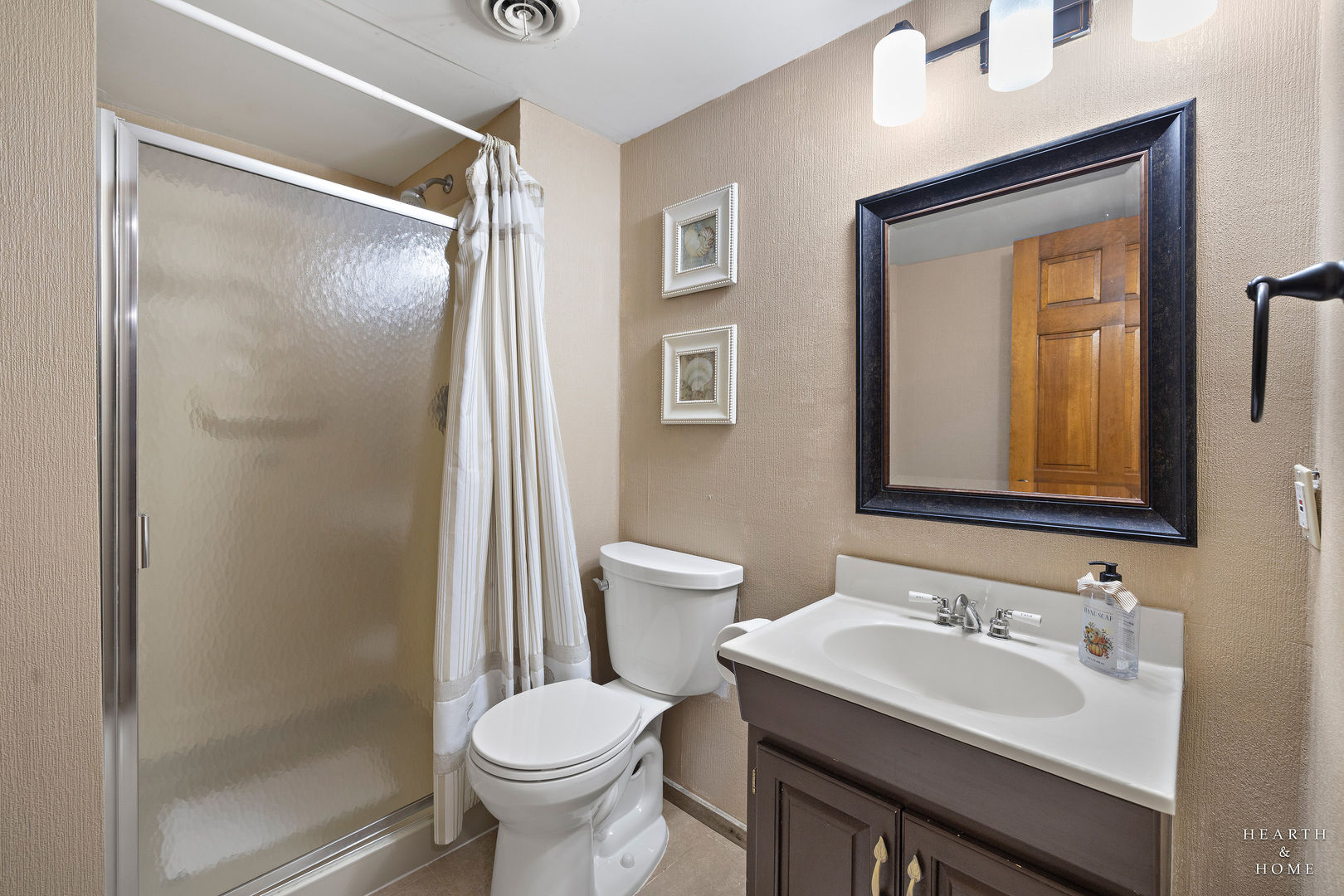 41 Manchester Court Fox River Grove, IL 60021 - Photo 35 of 57 a bathroom with a sink toilet and shower