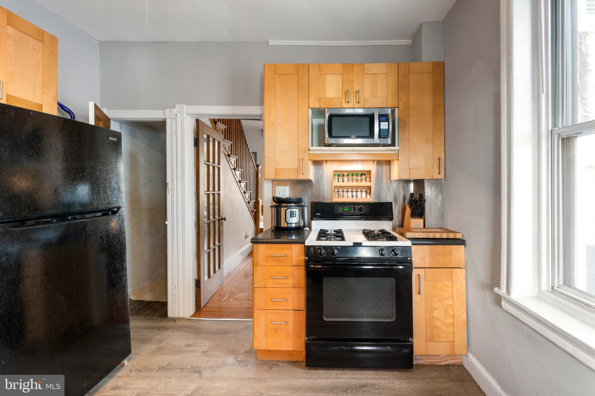 134 Davis Street Philadelphia, PA 19127 - Photo 15 of 33 a kitchen with stainless steel appliances granite countertop a stove a refrigerator and a microwave
