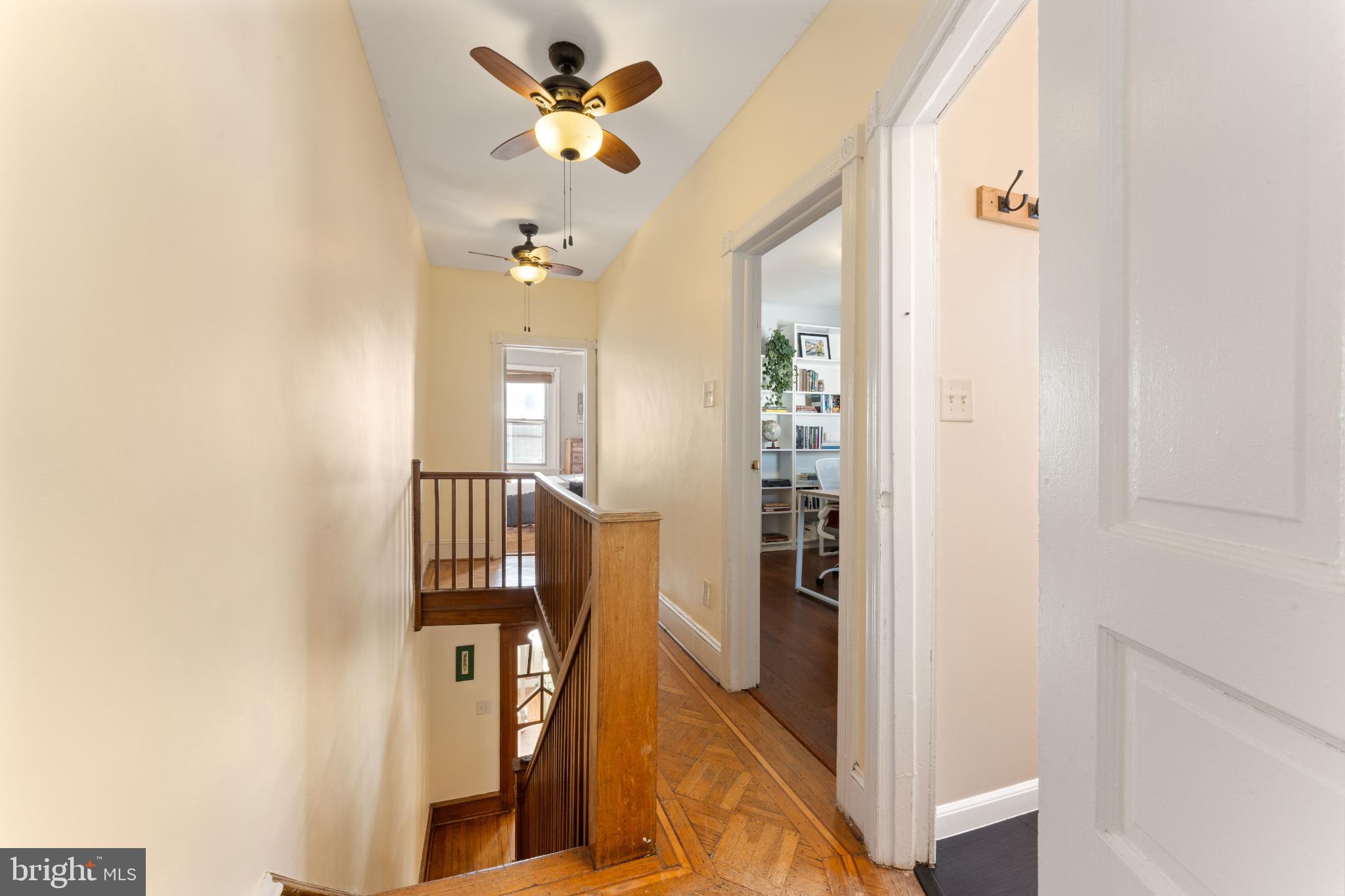 134 Davis Street Philadelphia, PA 19127 - Photo 18 of 33 a view of a hallway with wooden floor and a bathroom