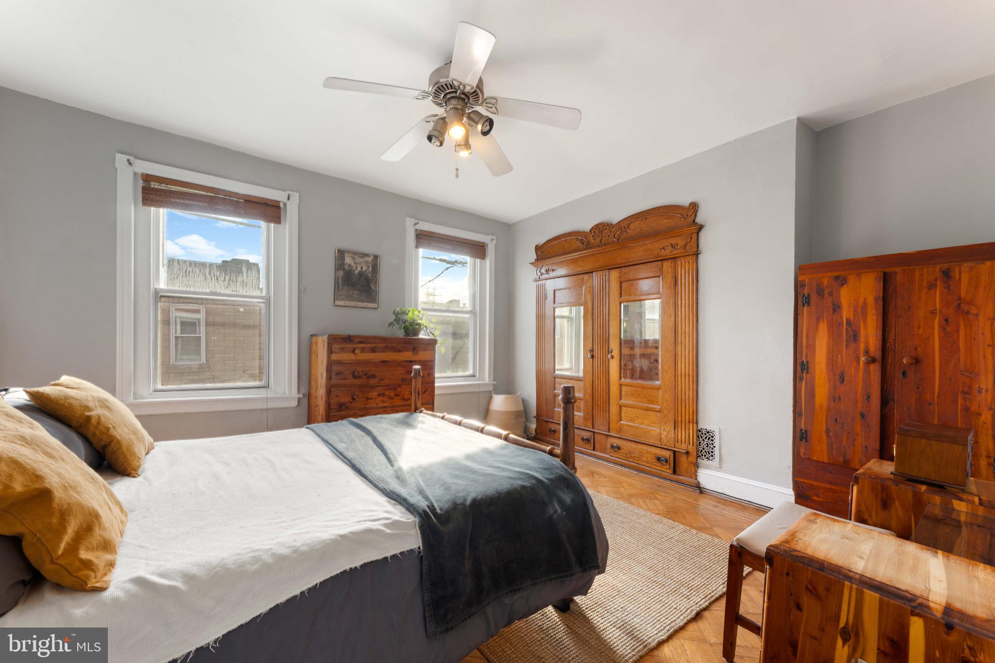 134 Davis Street Philadelphia, PA 19127 - Photo 19 of 33 a bedroom with a bed and glass walk in closet