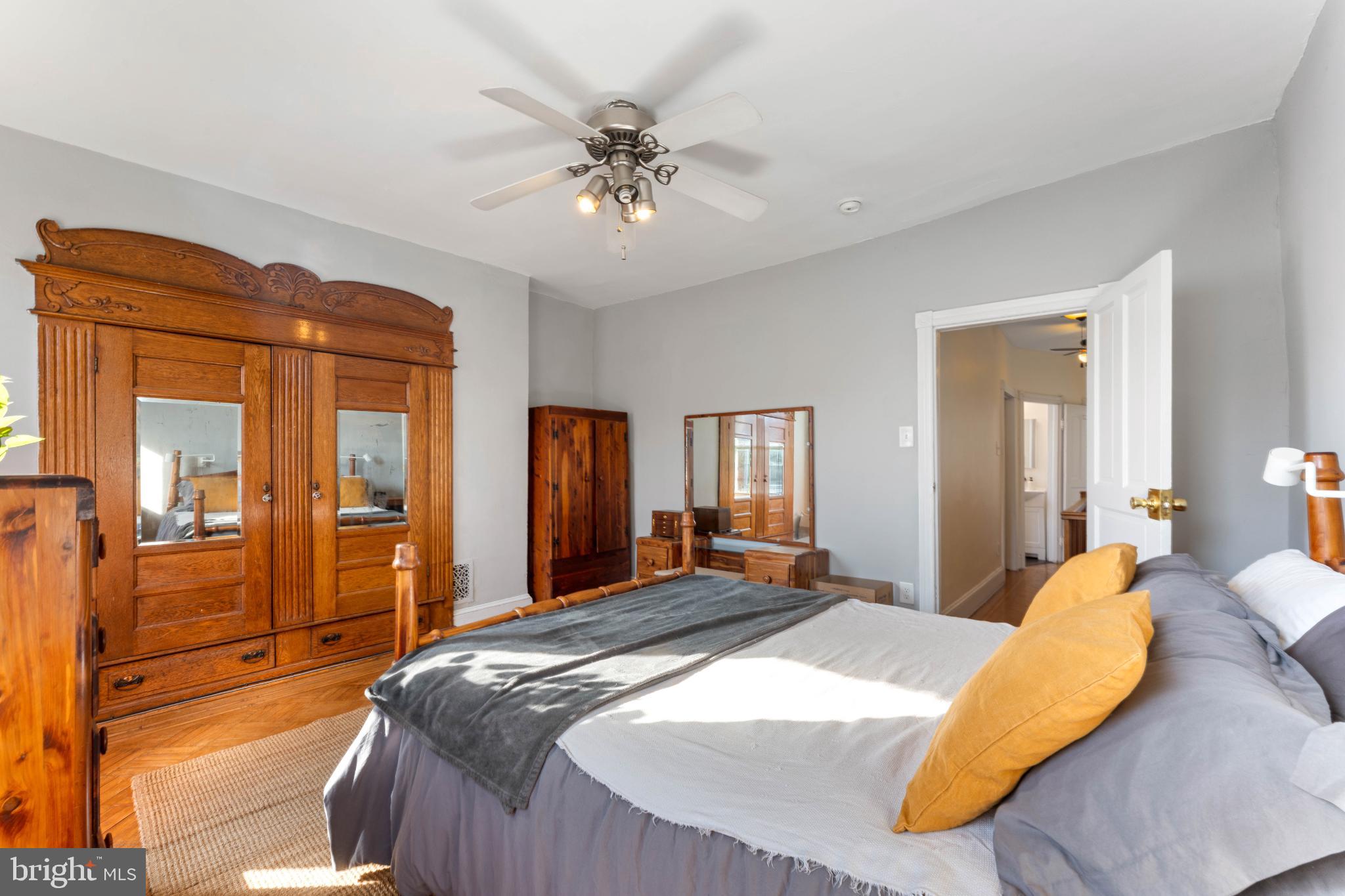 134 Davis Street Philadelphia, PA 19127 - Photo 21 of 33 a bedroom with a large bed and a chandelier