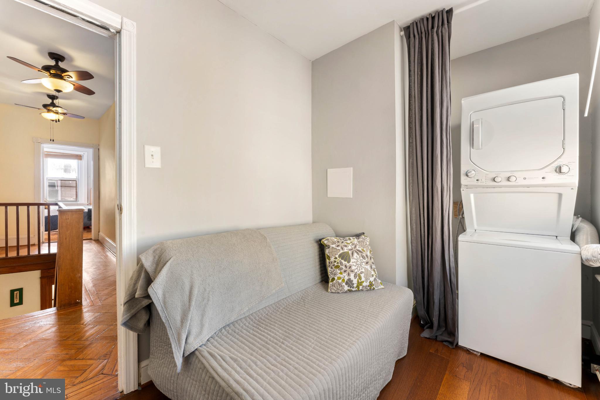 134 Davis Street Philadelphia, PA 19127 - Photo 28 of 33 a bedroom with a bed and a chandelier