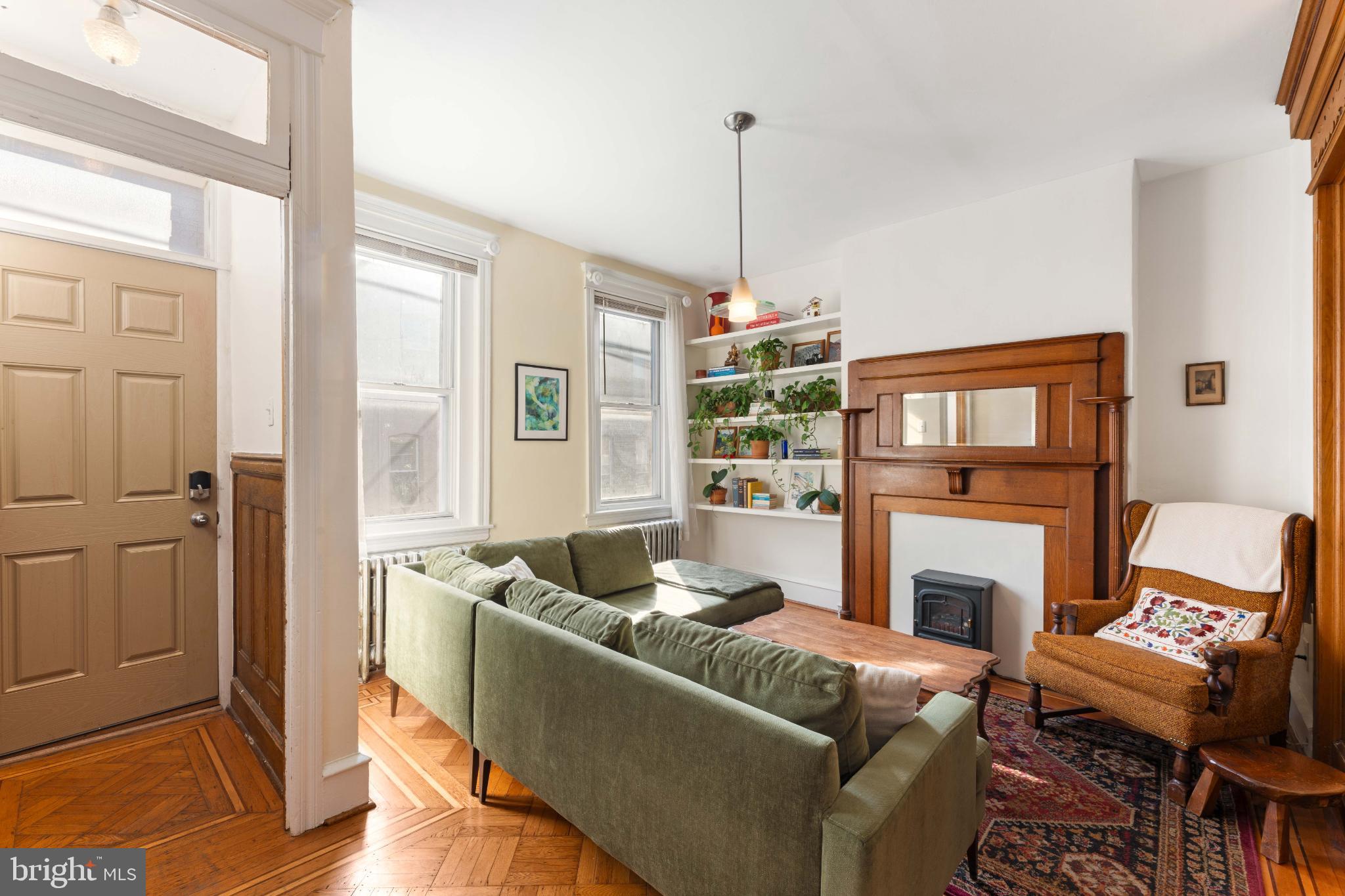 134 Davis Street Philadelphia, PA 19127 - Photo 3 of 33 a living room with furniture and a fireplace