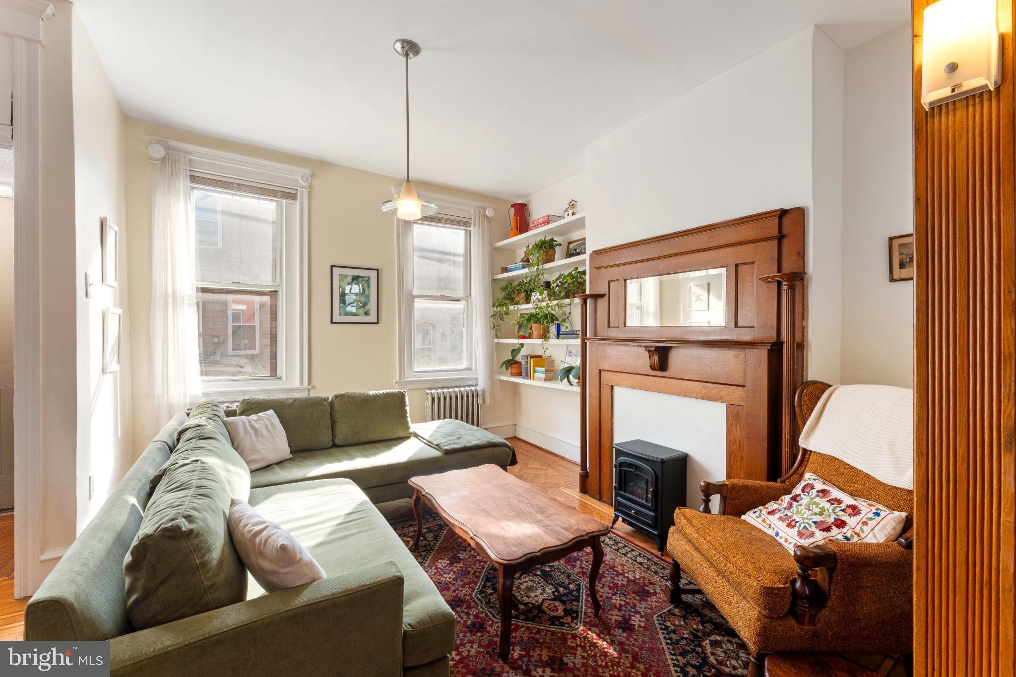 134 Davis Street Philadelphia, PA 19127 - Photo 4 of 33 a living room with furniture fireplace and a window