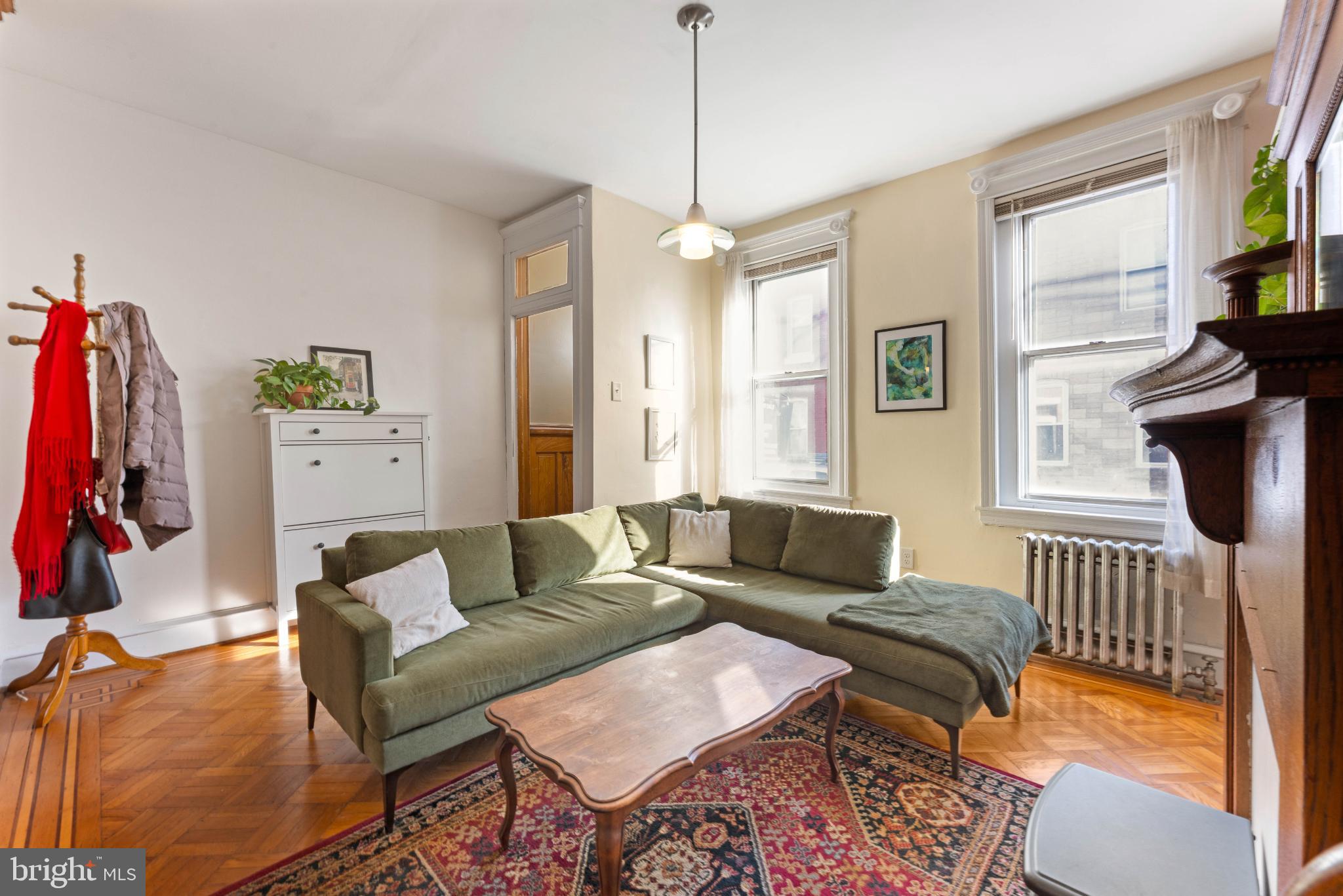 134 Davis Street Philadelphia, PA 19127 - Photo 8 of 33 a living room with furniture a flat screen tv and a window